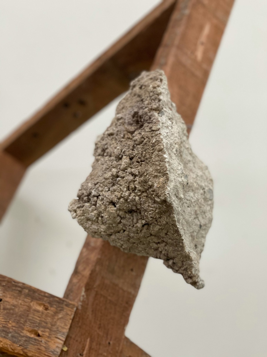 Untitled - A sculpture by Brian Dario, Closeup of a chiseled concrete footing chunk, showcasing the texture of the broken concrete